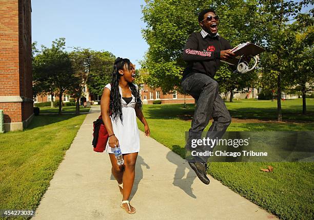 Wase Tembo left, a native of Lusaka, Zambia and a senior at Lake Forest College in Lake Forest, Ill., laughs July 18, 2014 along with friend Tyler...