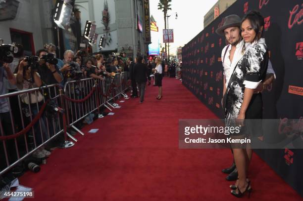 Marco Perego and actress Zoe Saldana attend the premiere of Pantelion Film's "Cantinflas" at TCL Chinese Theatre on August 27, 2014 in Hollywood,...