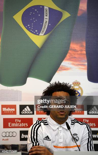 Real Madrid's Brazilian defender Marcelo looks on as he gives a press conference with his teammates to give their thoughts on 2014 World Cup draw, at...