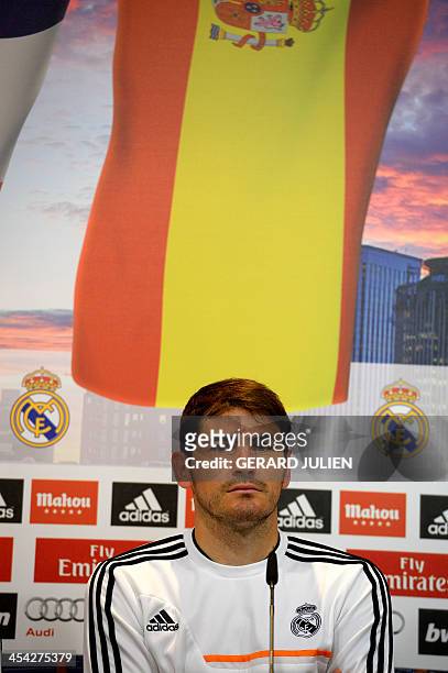 Madrid's Spanish goalkeeper Iker Casillas looks on as he gives a press conference with his teammates to give their thoughts on 2014 World Cup draw,...
