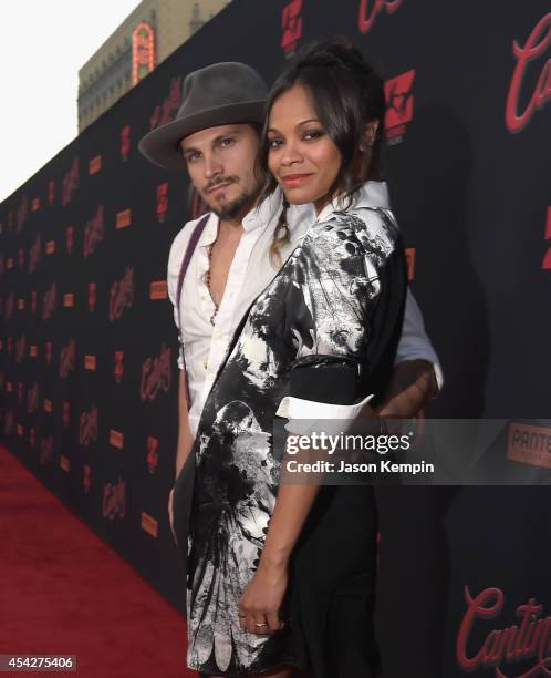 Marco Perego and actress Zoe Saldana attend the premiere of Pantelion Film's "Cantinflas" at TCL Chinese Theatre on August 27, 2014 in Hollywood,...