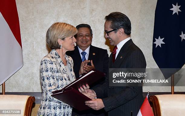 Indonesian President Susilo Bambang Yudhoyono witnesses Australian Foreign Minister Julie Bishop and her Indonesian counterpart Marty Natalegawa...