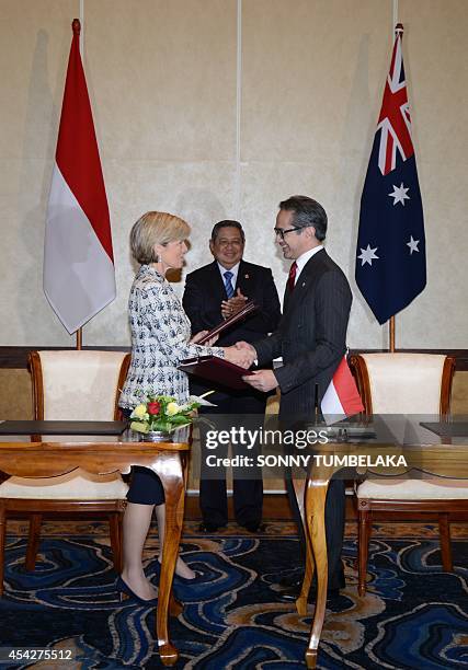 Indonesian President Susilo Bambang Yudhoyono witnesses Australian Foreign Minister Julie Bishop and her Indonesian counterpart Marty Natalegawa...
