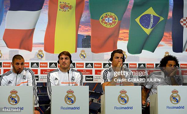 Real Madrid football players, French forward Karim Benzema, Spanish goalkeeper Iker Casillas, Portuguese forward Cristiano Ronaldo and Brazilian...