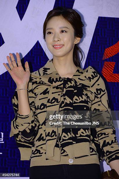 Lee Chung-Ah poses for photographs during the movie "Tazza: The High Rollers 2" VIP premiere at Geondae Lotte Cinema on August 25, 2014 in Seoul,...