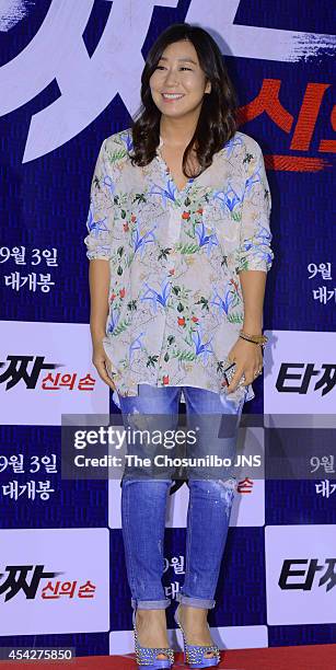 Ra Mi-Ran poses for photographs during the movie "Tazza: The High Rollers 2" VIP premiere at Geondae Lotte Cinema on August 25, 2014 in Seoul, South...