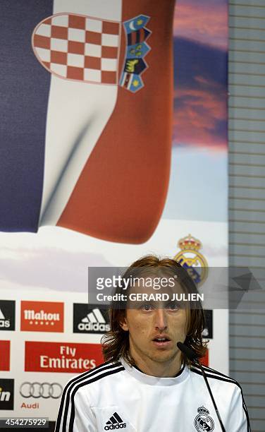 Real Madrid's Croatian midfielder Luka Modric looks on as he gives a press conference with his teammates to give their thoughts on 2014 World Cup...