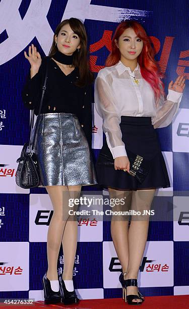 Park Sandara and Kong Min-Ji of 2NE1 pose for photographs during the movie "Tazza: The High Rollers 2" VIP premiere at Geondae Lotte Cinema on August...