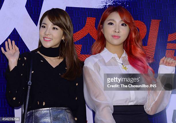 Park Sandara and Kong Min-Ji of 2NE1 pose for photographs during the movie "Tazza: The High Rollers 2" VIP premiere at Geondae Lotte Cinema on August...