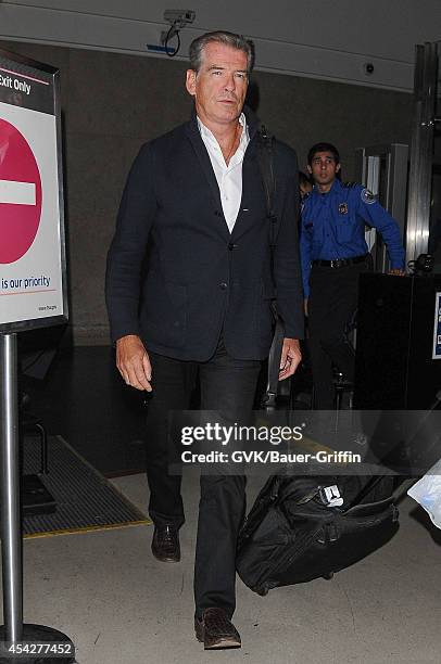 Pierce Brosnan is seen at LAX on August 27, 2014 in Los Angeles, California.