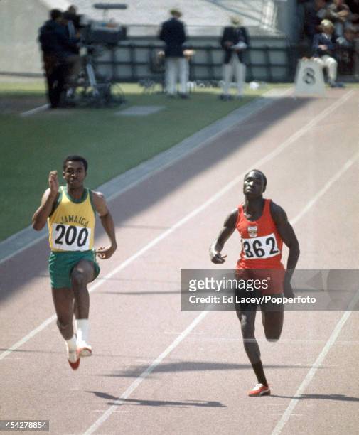 Don Quarrie of Jamaica and William Dralu of Uganda in a men's 100 metres heat during the British Commonwealth Games at the Meadowbank Stadium in...