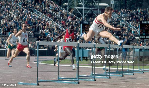 John Sherwood of England winning the 400 metres hurdles final during the British Commonwealth Games at the Meadowbank Stadium in Edinburgh, circa...