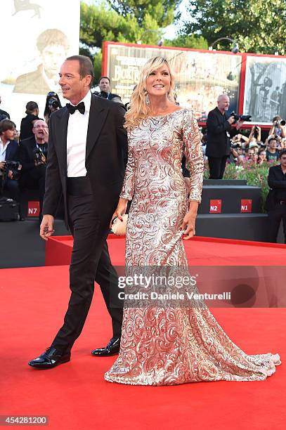 Marco Costantini and Matilde Brandi attend the Opening Ceremony and 'Birdman' premiere during the 71st Venice Film Festival at Palazzo Del Cinema on...