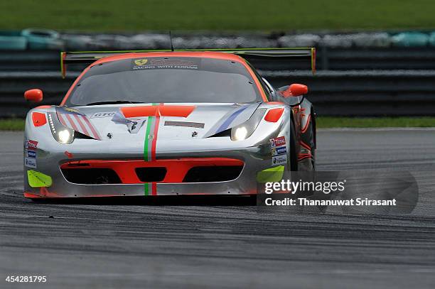 Weng Sun Mok of Malaysia and Toni Vilander of Finland dives the Clearwater Racing Ferrari 458 GT3 during the Asian Lemans Series on December 8, 2013...