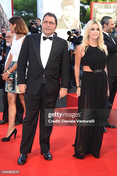 Marco De Benedetti and Paola Ferrari attend the Opening Ceremony and 'Birdman' premiere during the 71st Venice Film Festival at Palazzo Del Cinema on...