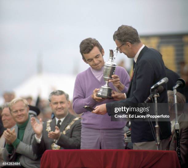 Tony Jacklin of Great Britain, winner of the British Open, receives the claret jug from Lord Derby at Lytham St Annes on 12th July 1969. Jack...