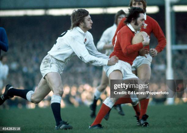 Roger Blyth of Wales is tackled by Keith Smith of England during the Five Nations international rugby match at Twickenham in London on 16th March...