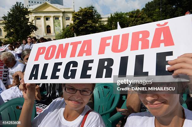 Supporters of Christian Liberal Alliance , the main opposition aliance hold a pancarte reading in Romanian "Ponta steal the elections" during a...