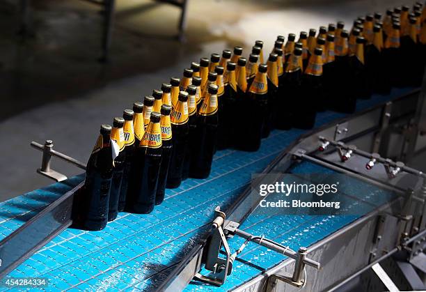 Bottles of Cobra beer, manufactured by Molson Coors Brewing Co., pass along the production line at the company's brewery and bottling plant in...