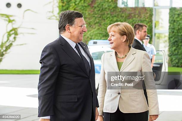 German Chancellor Angela Merkel greets European Commission President Jose Manuel Barroso upon his arrival for the German government Balkan conference...