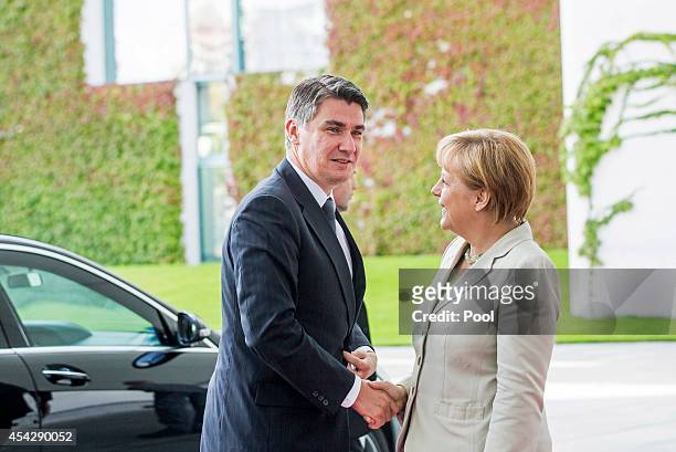 German Chancellor Angela Merkel welcomes Prime Minister of Croatia Zoran Milanovic to the German government Balkan conference at the Chancellery on...