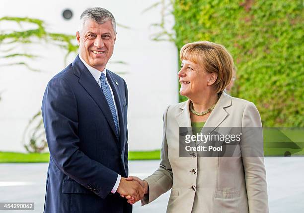 German Chancellor Angela Merkel welcomes caretaker Prime Minister of Kosovo Hashim Taci to the German government Balkan conference at the Chancellery...