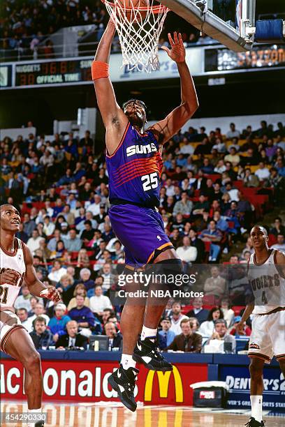 Oliver Miller of the Phoenix Suns shoots against the Denver Nuggets circa 1994 at the McNichols Sports Arena in Denver, Colorado. NOTE TO USER: User...