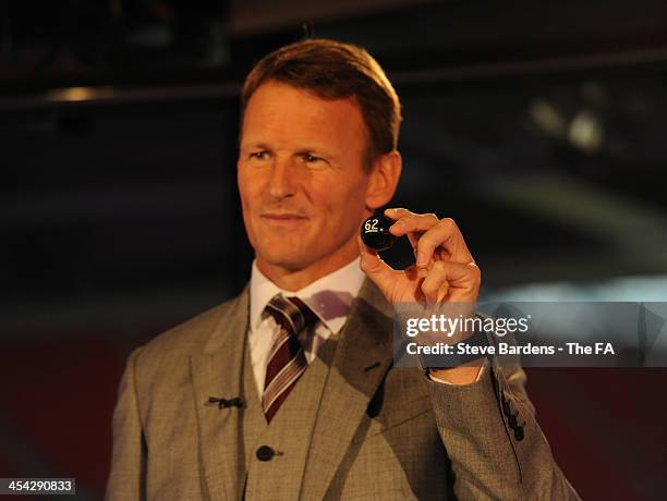 Teddy Sheringham chooses a ball during the FA Cup Third Round Draw at Wembley Stadium on December 8, 2013 in London, England.