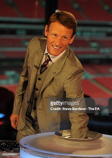 Teddy Sheringham chooses a ball during the FA Cup Third Round Draw at Wembley Stadium on December 8, 2013 in London, England.