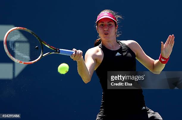 Christina McHale of the United States returns a shot against Victoria Azarenka of Belarus during their women's singles second round match on Day Four...
