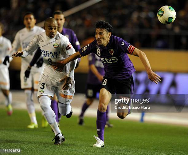 Jun Ando of Kyoto Sanga and Alex of Tokushima Voltis compete for the ball during the J.League Play-Off final match between Kyoto Sanga and Tokushima...