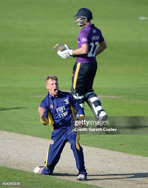 Scott Borthwick of Durham celebrates dismissing Gary Ballance of Yorkshire during the Royal London One-Day Cup 2014 Quarter Final between Yorkshire...