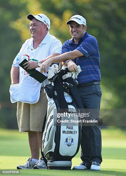 Ryder Cup Captain Paul McGinley of Ireland and caddie share a joke during the first round of the 71st Italian Open Damiani at Circolo Golf Torino on...