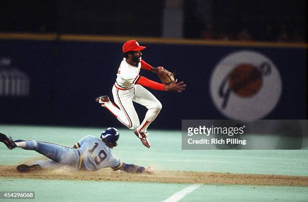 Ozzie Smith of the St. Louis Cardinals turns a double play during World Series game two between the St. Louis Cardinals and Milwaukee Brewers on...