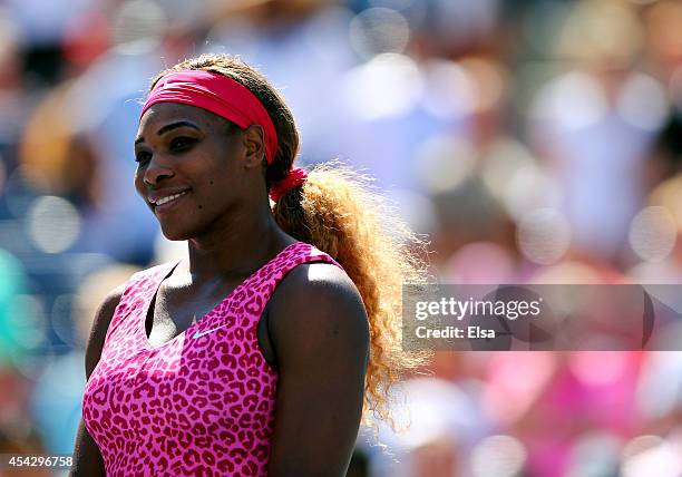 Serena Williams of the United States celebrates after defeating Vania King of the United States during their women's singles second round match on...