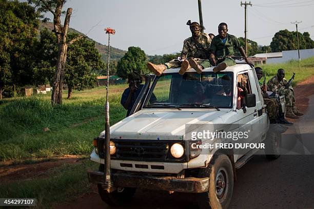 Ex-Seleka rebels drive in a truck in Bangui in Central African Republic on December 8, 2013. French troops poured into the impoverished landlocked...