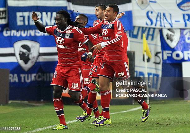 Lyon's French forward Bafetimbi Gomis celebrates with teammates after scoring a goal during the French L1 football match Bastia against Lyon in the...