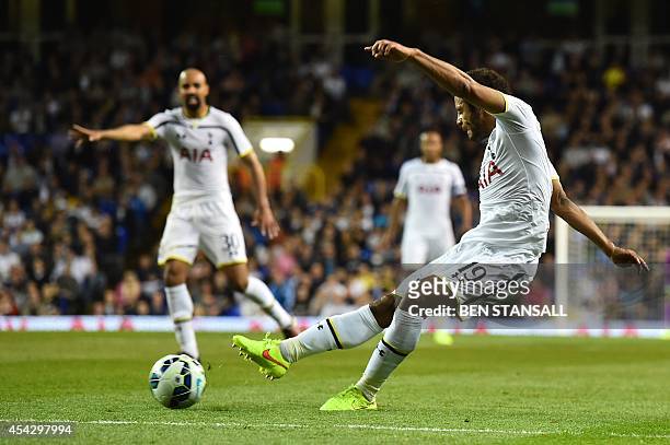 Tottenham Hotspur's Belgian midfielder Mousa Dembele has an unsuccessful shot on goal during the UEFA Europa League qualifying round play-off...