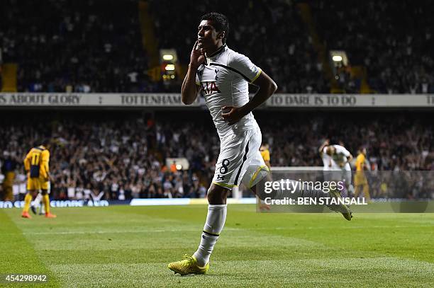 Tottenham Hotspur's Brazilian midfielder Paulinho celebrates scoring their second goal during the UEFA Europa League qualifying round play-off...