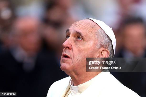 Pope Francis prays in front of the statue of the Immaculate Conceptionon at Spanish Steps December 8, 2013 in Rome, Italy. Following a tradition laid...