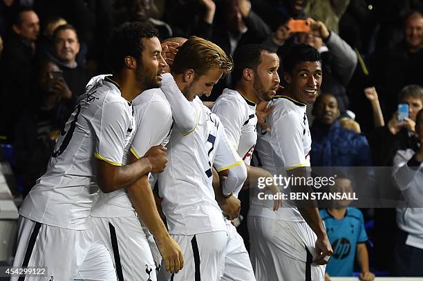 Tottenham Hotspur's Brazilian midfielder Paulinho celebrates scoring their second goal with teammates during the UEFA Europa League qualifying round...