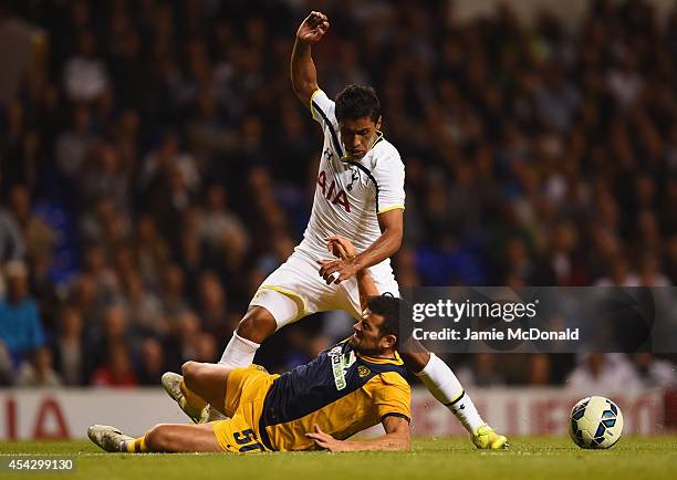 Paulinho of Spurs is tackled by Ricardo Manuel Ferreiras Sousa of AEL Limassol during the UEFA Europa League Qualifying Play-Offs Round Second Leg...