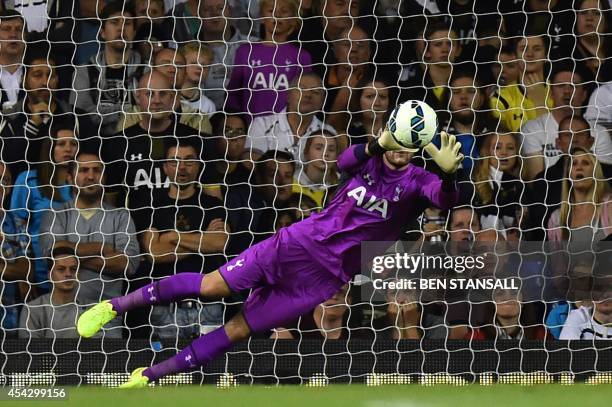 Tottenham Hotspur's French goalkeeper Hugo Lloris makes a save during the UEFA Europa League qualifying round play-off second-leg football match...