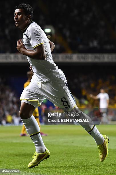 Tottenham Hotspur's Brazilian midfielder Paulinho wheels away to celebrate after scoring their second goal during the UEFA Europa League qualifying...