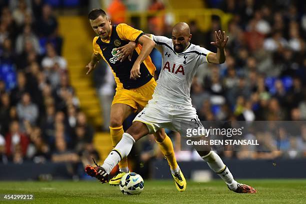 Tottenham Hotspur's Brazilian midfielder Sandro vies with AEL Limassol's Polish midfielder Lukasz Gikiewicz during the UEFA Europa League qualifying...