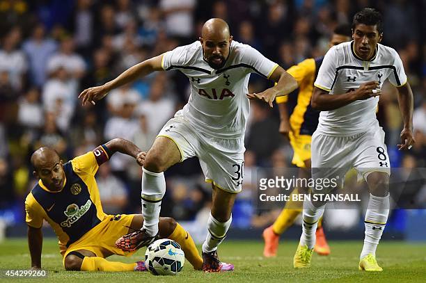 Tottenham Hotspur's Brazilian midfielder Sandro beats AEL Limassol's Brazilian midfielder Luciano Bebe during the UEFA Europa League qualifying round...