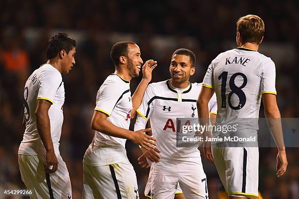 Andros Townsend of Spurs celebrates scoring theiur third goal from the penalty spot with Aaron Lennon, Paulinho and Harry Kane of Spurs during the...