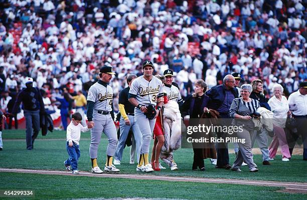 Jose Canseco and members of the Oakland Athletics leave Candlestick Park with their families after the Loma Prieta earthquake hit prior to World...