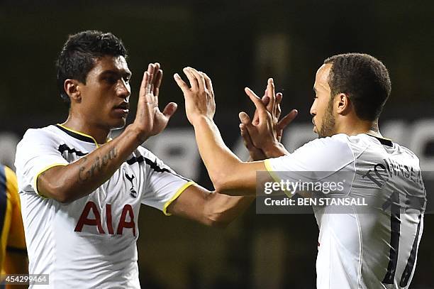 Tottenham Hotspur's English midfielder Andros Townsend celebrates with Tottenham Hotspur's Brazilian midfielder Paulinho after scoring from the...