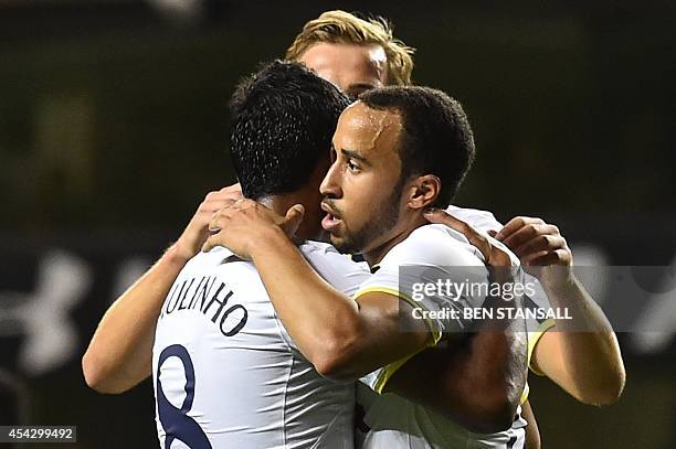 Tottenham Hotspur's English midfielder Andros Townsend celebrates with Tottenham Hotspur's Brazilian midfielder Paulinho after scoring from the...